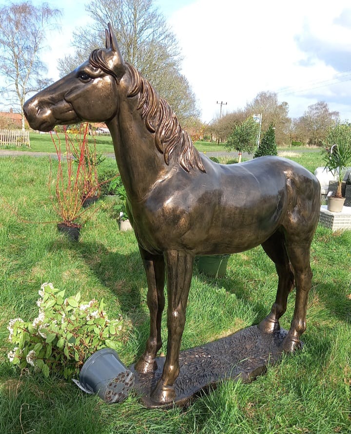 Bronze horse statue in garden