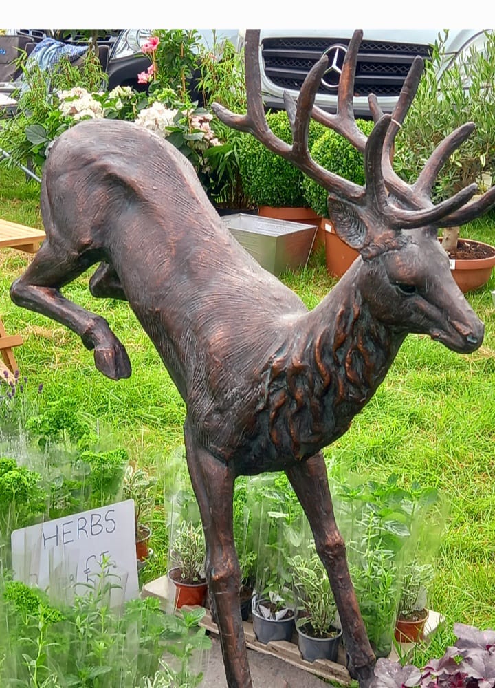 Leaping stag statue in dynamic pose