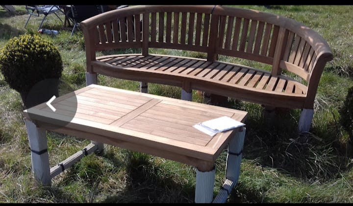Curved wooden garden bench and table
