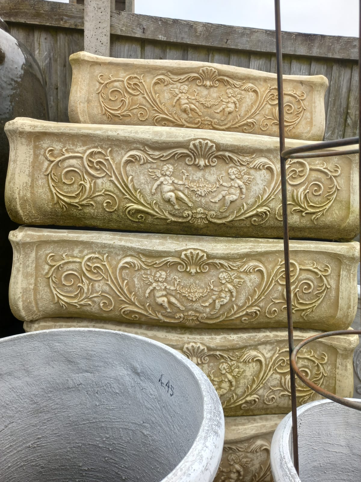 Ornate garden planters in sandstone finish