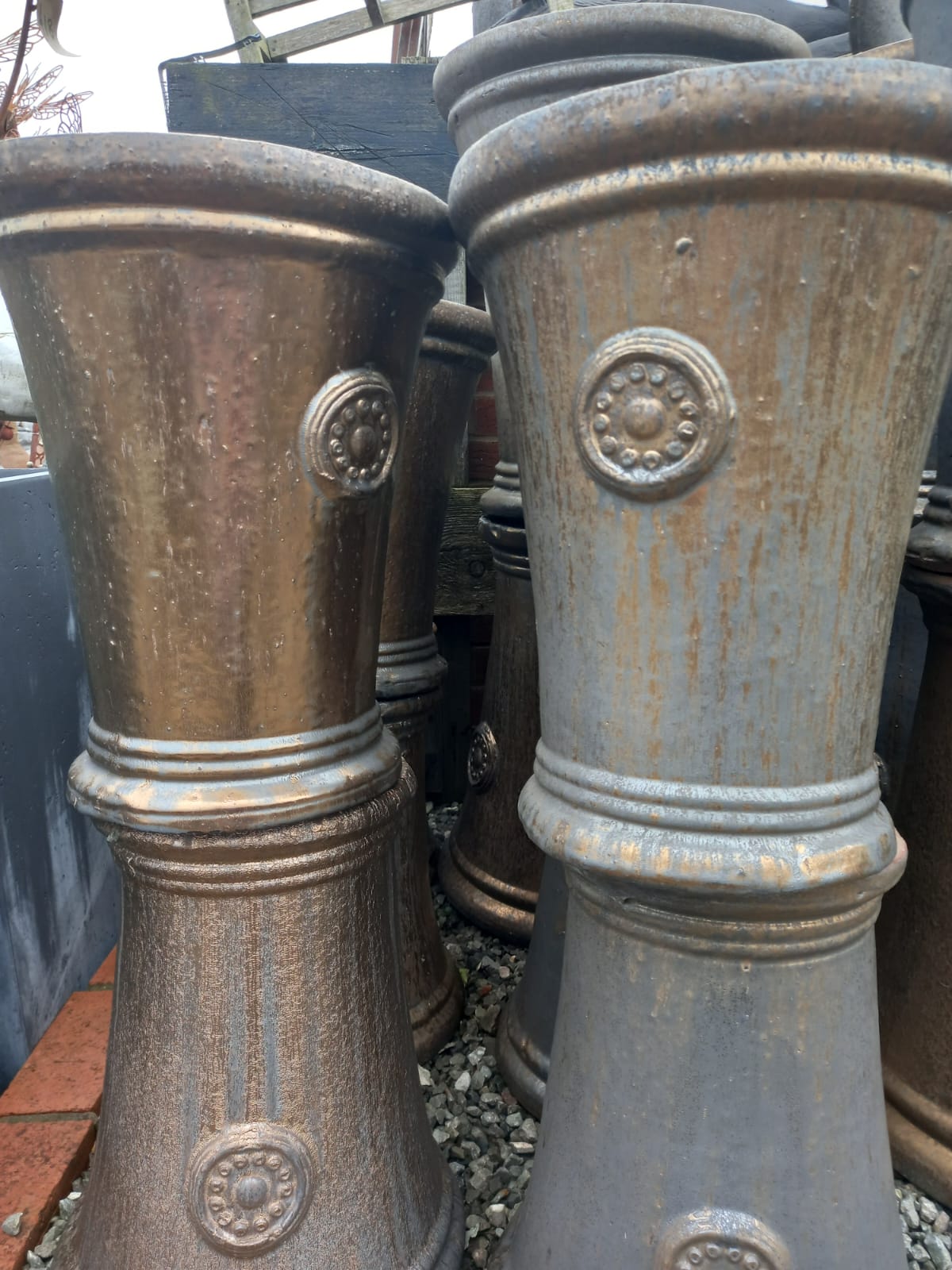 Large decorative urns with medallion details