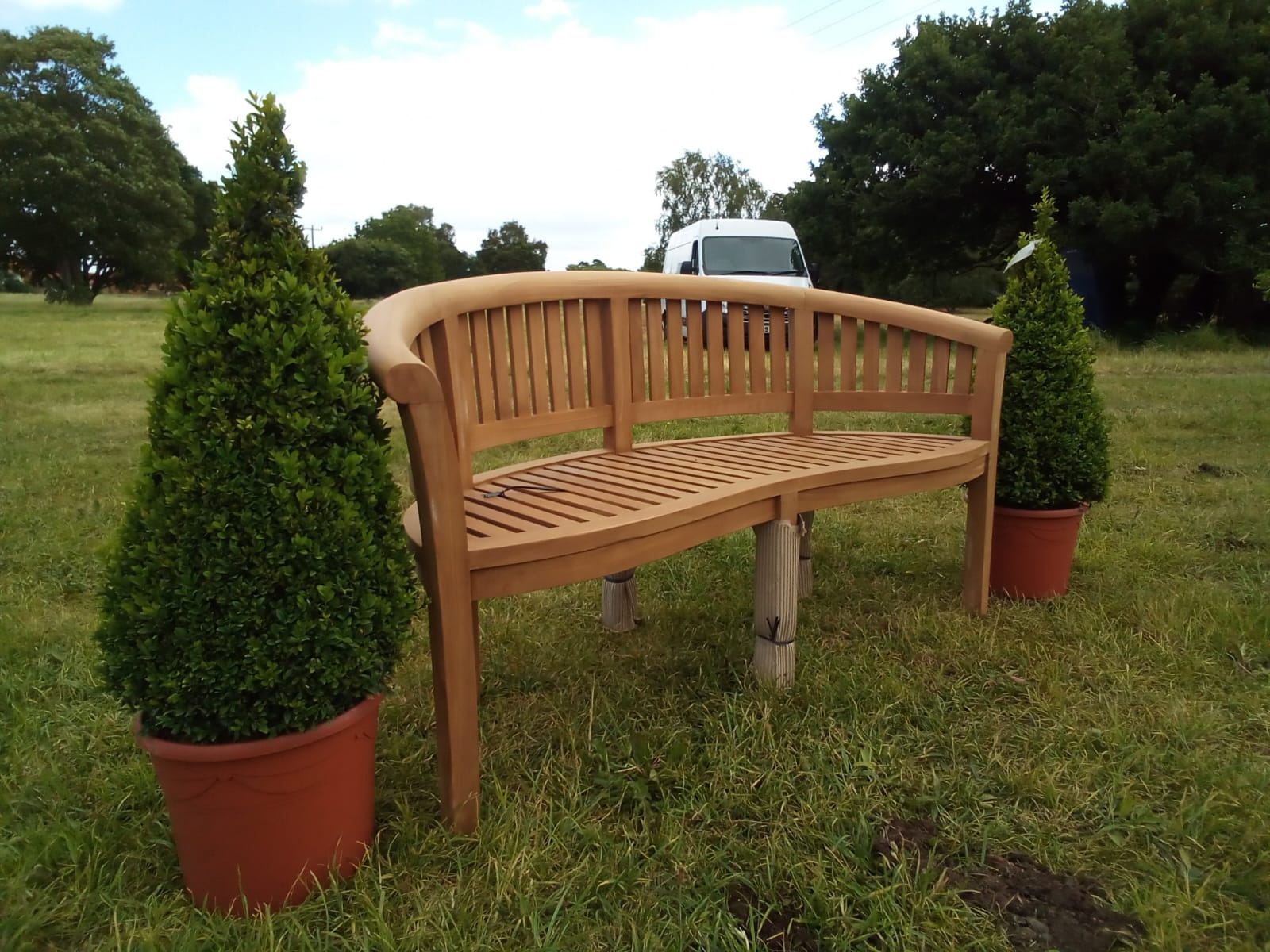 Curved bench with willow trellis